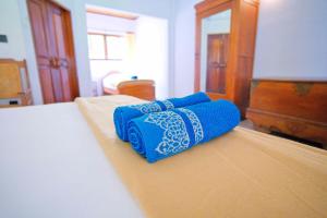Postel nebo postele na pokoji v ubytování Uns Hotel - Bali
