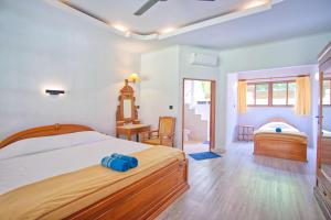 Postel nebo postele na pokoji v ubytování Uns Hotel - Bali
