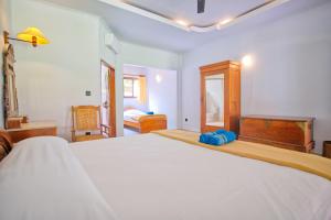 Postel nebo postele na pokoji v ubytování Uns Hotel - Bali