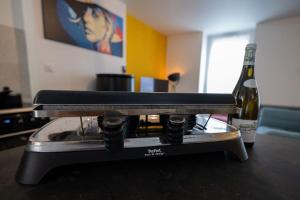 TV a/nebo společenská místnost v ubytování Le Twelve CHABLIS Maison chaleureuse, calme, 2 chambres