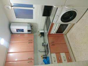 an overhead view of a kitchen with a washing machine at Motril - Poniente Beach in Motril +9 photos