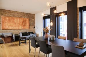 a dining room with a table and chairs at Søndergade - “strøget” in Aarhus
