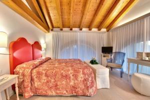 A bed or beds in a room at Agriturismo Ca' Beatrice - Venice Airport