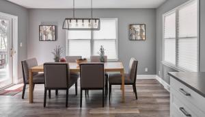 a dining room with a table and chairs at Fun-tana by Simple Life Rentals in Lake Geneva