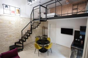 TV a/nebo společenská místnost v ubytování Dimora in Cortile