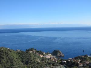 a view of the ocean from a hill at Villa Astoria in Taormina