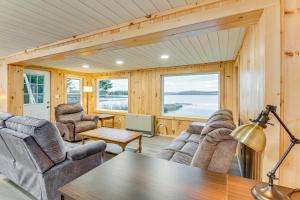 a living room with chairs and a table at Waterfront Oasis Family Retreat on Long Lake! in Sinclair