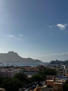 a view of a city with mountains in the background at Fanon Flat T2 in Mindelo