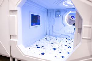 Postel nebo postele na pokoji v ubytování QUICK'HOT By GTS - capsules et chambres confortables