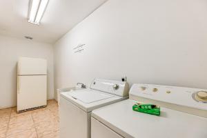 a kitchen with a washing machine and a refrigerator at Convenient, Spacious and Peaceful Home in Edinburg! in Edinburg +17 photos