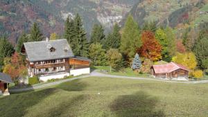 an aerial view of a house on a hill at Staubbachbänkli in Wengen