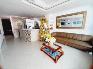 a living room with a couch and a table at Karin Hotel in Ríohacha