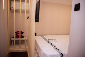 Postel nebo postele na pokoji v ubytování QUICK'HOT By GTS - capsules et chambres confortables