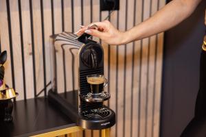 Nápoje v ubytování QUICK'HOT By GTS - capsules et chambres confortables