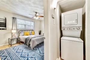 a bedroom with a bed with yellow pillows at Global Cup Insta-Worthy Flat and Arboretum Tickets Included in Dallas