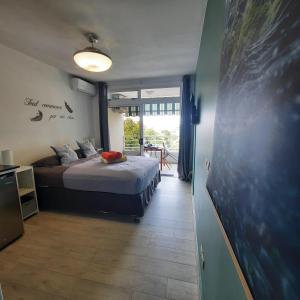 Katil atau katil-katil dalam bilik di Little home Tahiti