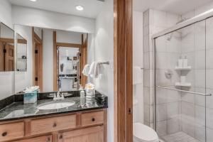 a bathroom with a sink and a shower at Laurelwood Condominiums 306 in Snowmass Village +17 photos