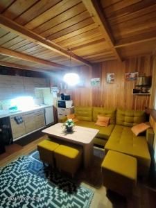 a living room with a couch and a table at Kuligowka Szklarska Poreba in Szklarska Poręba
