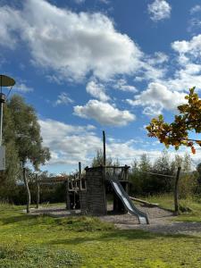 a playground with a slide in a park at Familienfreundliche FEWO in bester Lage in Offenburg