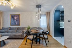 a living room with a couch and a table at Royal Residence Zlatibor in Zlatibor