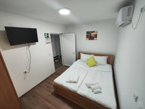Postel nebo postele na pokoji v ubytování Apartmani - Kladovski Konak