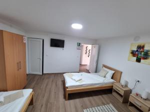 Postel nebo postele na pokoji v ubytování Apartmani - Kladovski Konak