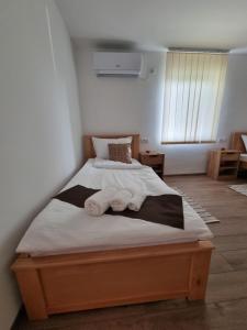 Postel nebo postele na pokoji v ubytování Apartmani - Kladovski Konak