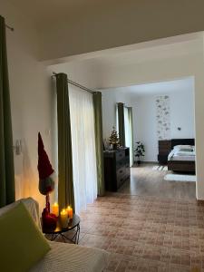 a living room with a santa hat on a table with candles at Krisztina Vendégház in Zalaszentlászló