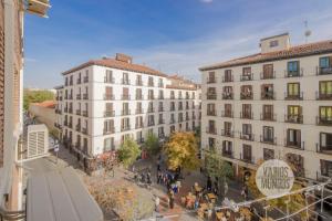 an overhead view of a city with buildings at Sutil elegancia para 3, en Plaza de Chueca in Madrid