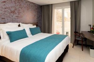 Sable Bleu Boutique Hotel客房内的一张或多张床位