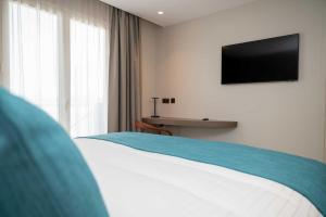 Sable Bleu Boutique Hotel客房内的一张或多张床位