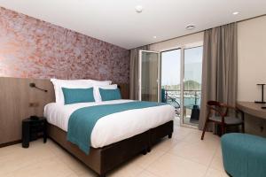 Sable Bleu Boutique Hotel客房内的一张或多张床位