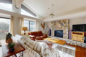 a living room with a couch and a fireplace at Bear-foot Retreat in Incline Village