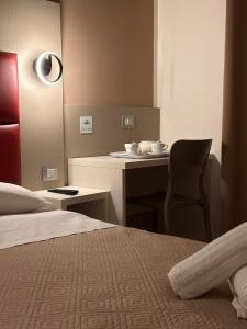 A bed or beds in a room at Hotel City 20