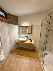 a bathroom with a sink and a shower at Miele B&B in Vinchiaturo +37 photos