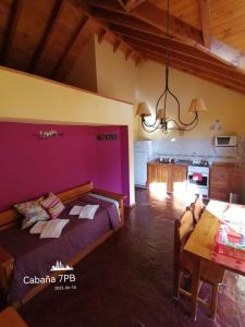 a bedroom with a bed and a table in a room at Don Justo in San Carlos de Bariloche +84 photos