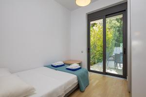 Posteľ alebo postele v izbe v ubytovaní Villa Darazzo with Private Pool