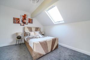 a bedroom with a bed with a skylight at -75CR- Setup for your most relaxed and amazing stay in Leeds