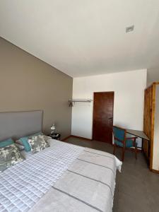 Кровать или кровати в номере La Morada Apart