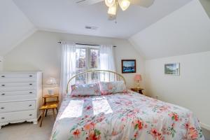 a bedroom with a bed and a dresser and a window at Waterfront Lake Anna Home Kayaks and Private Dock in Mineral
