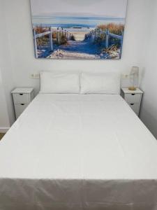 En eller flere senge i et værelse på Playa y Sol z1 + 3 billeder