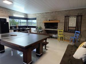 a living room with a ping pong table in it at Chacra LANATIVA in Poblado Echeverry