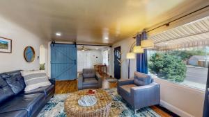 a living room with a couch and chairs and a table at Charming Downtown Bungalow - King Bed, Office in Twin Falls