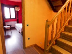 a hallway with a staircase leading to a bedroom at Nature Love in Casas del Abad