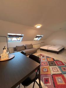 a living room with a table and a couch at City Apartment - Business&Uni - FREE WIFI in Bochum