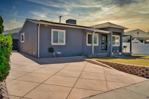 a small blue house with a driveway at Modern LA Home - King Bed, Outdoor Living, Firepit in Los Angeles