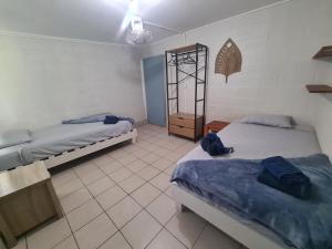Кровать или кровати в номере Blue Water Retreat