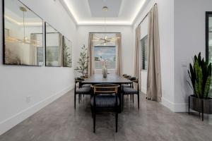 a dining room with a table and chairs at The Carlisle Luxe Villa in Scottsdale
