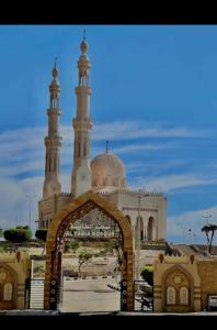 a mosque with a gate in front of it at Happy house Aswan in Aswan +65 photos