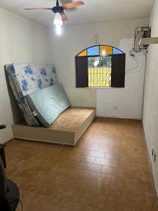 a room with a bed and a window at Casa de Muriqui in Mangaratiba